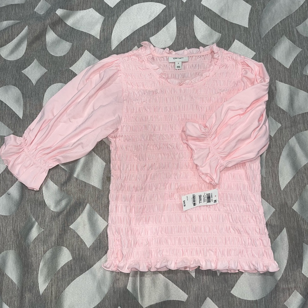 Pink ruffled blouse